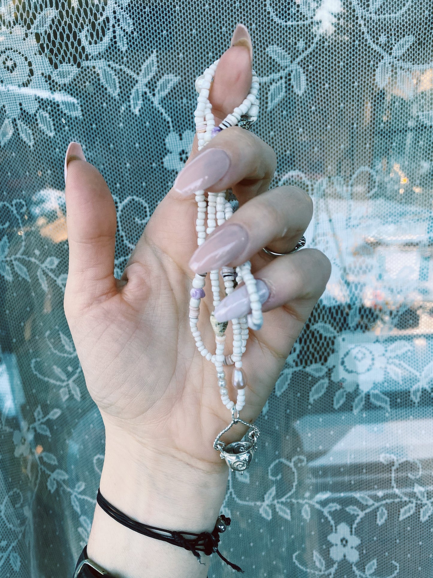 (reserved) shining sea // luminescent silver cauldron on beaded string