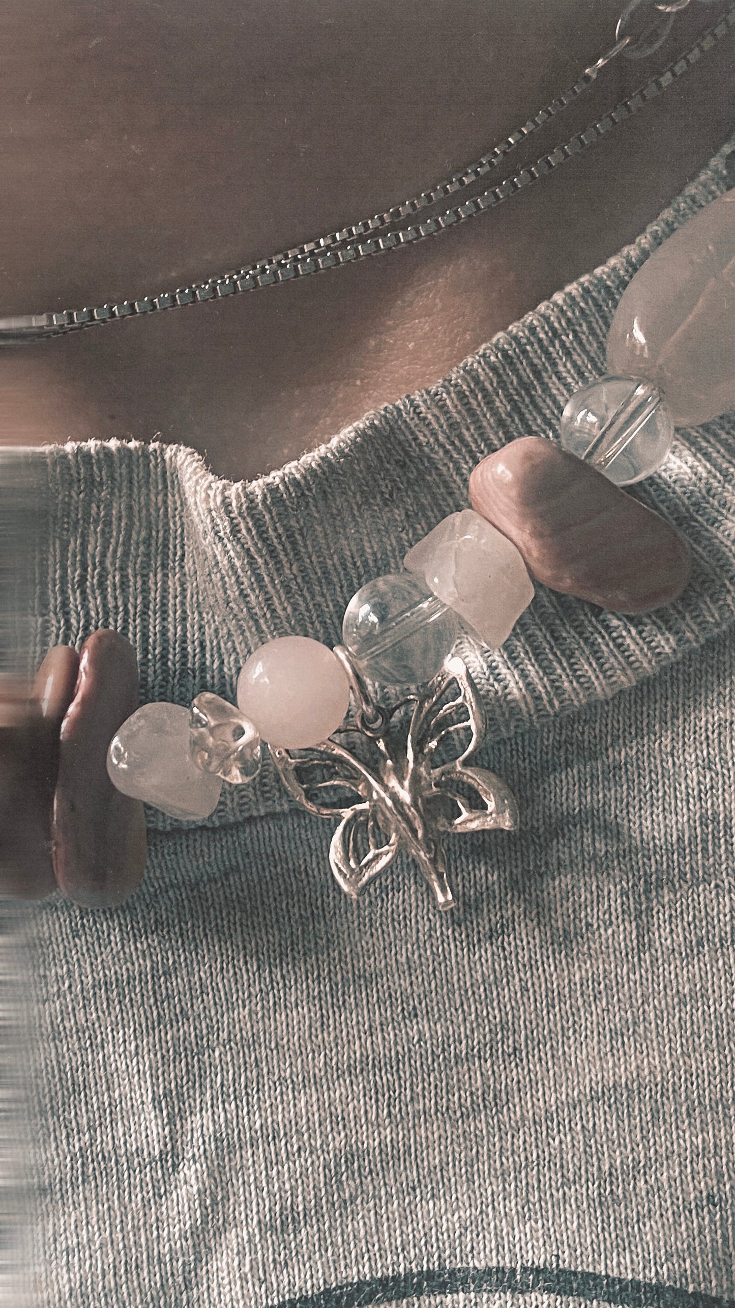 silver moth pendant on chunky textured strand