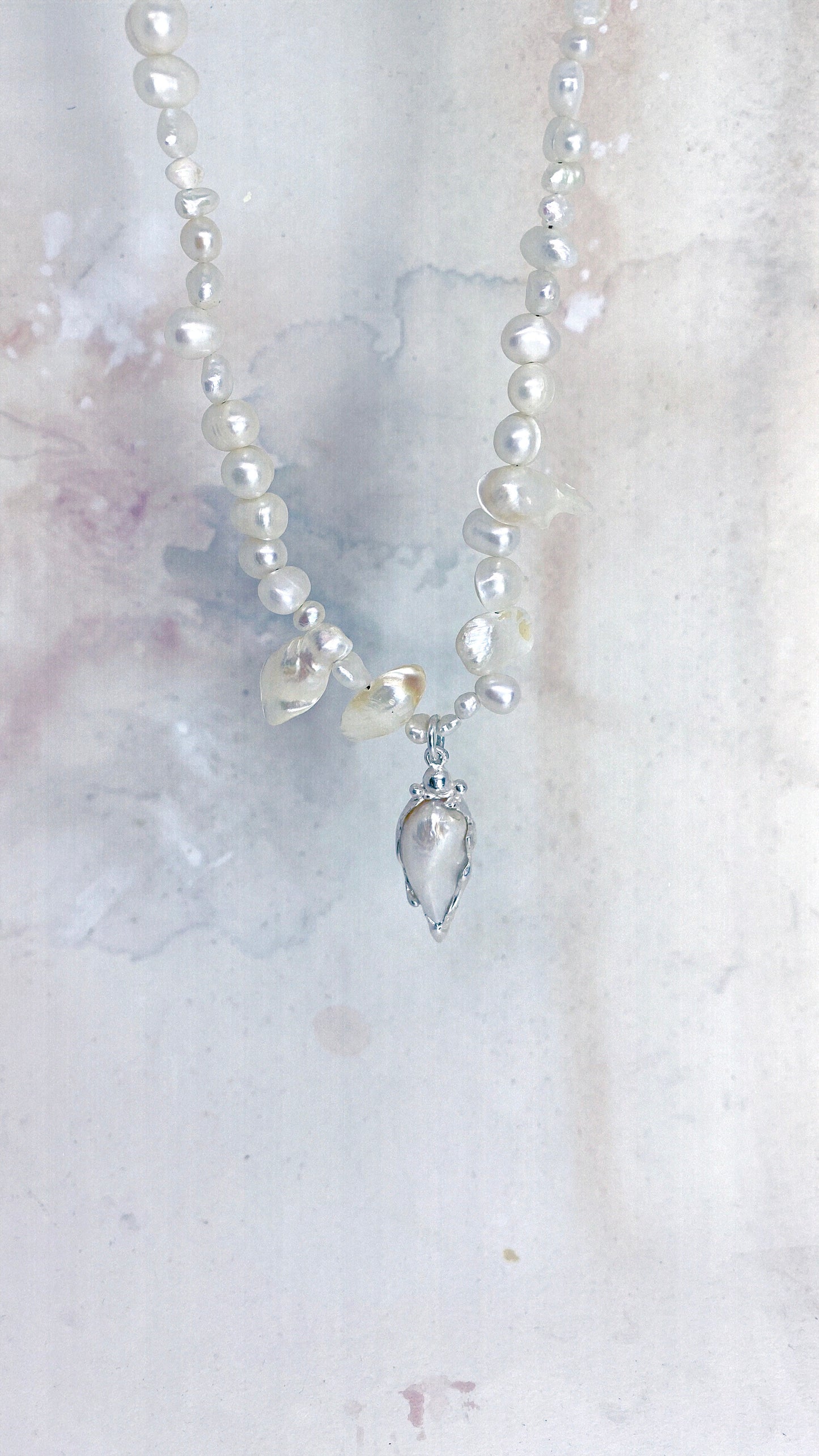 baroque blister teardrop pendant on flowing fresh water pearl strand