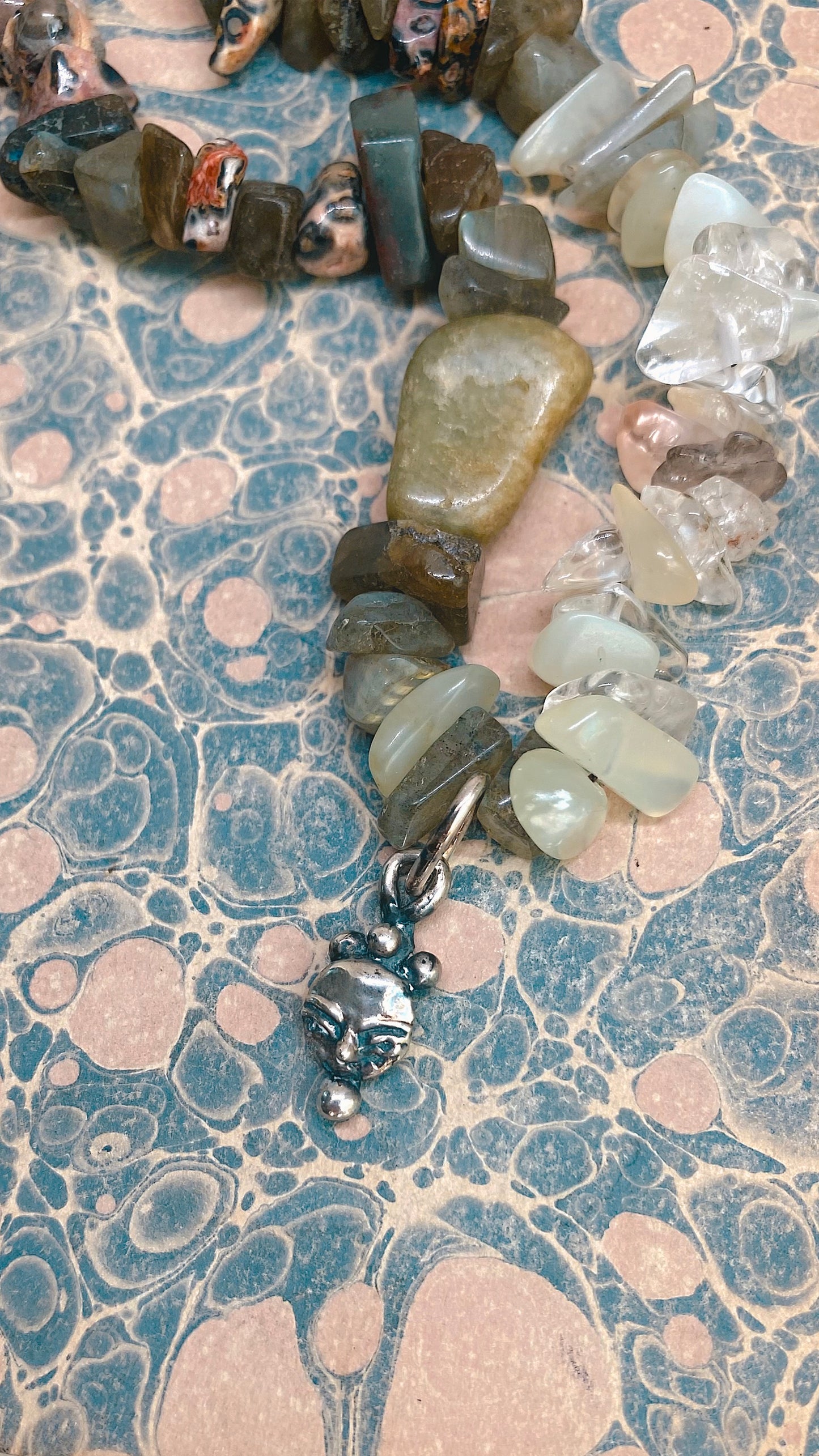 // RESERVED // mini droplet crowned moonface on gem gradient 𓅪 corvina 𓅪