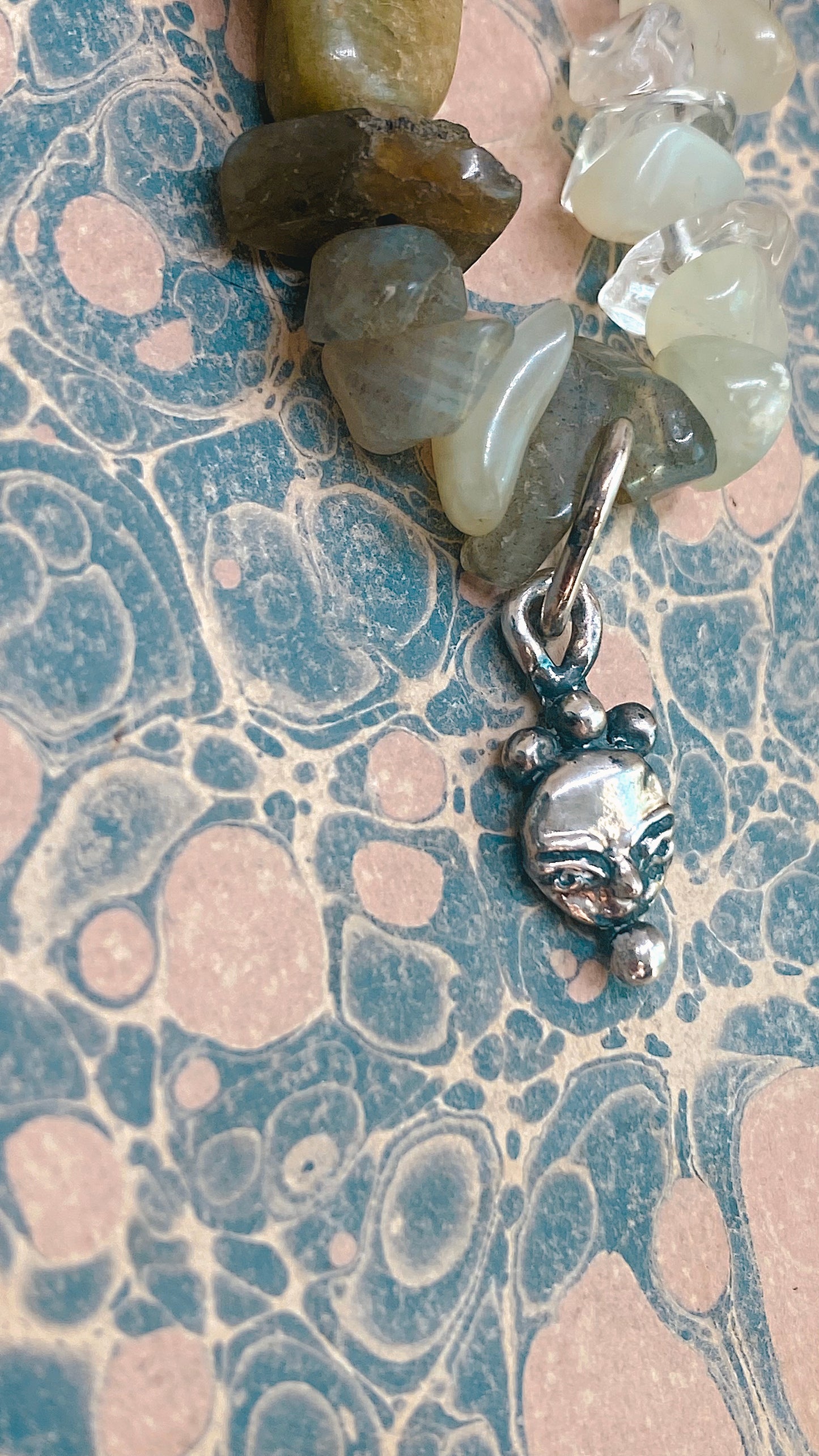 // RESERVED // mini droplet crowned moonface on gem gradient 𓅪 corvina 𓅪
