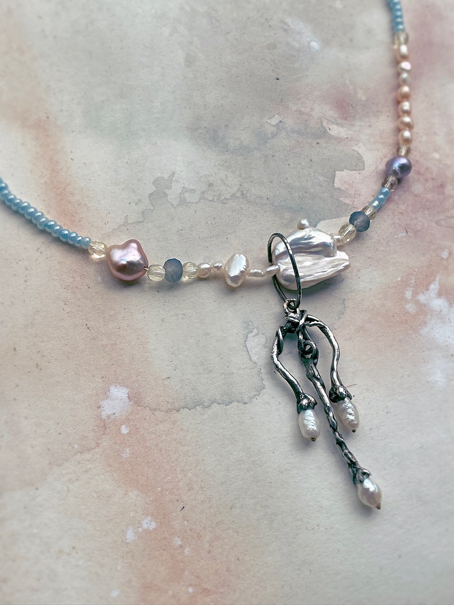 three pronged pearl fork with gemstone and giant baroque pearl