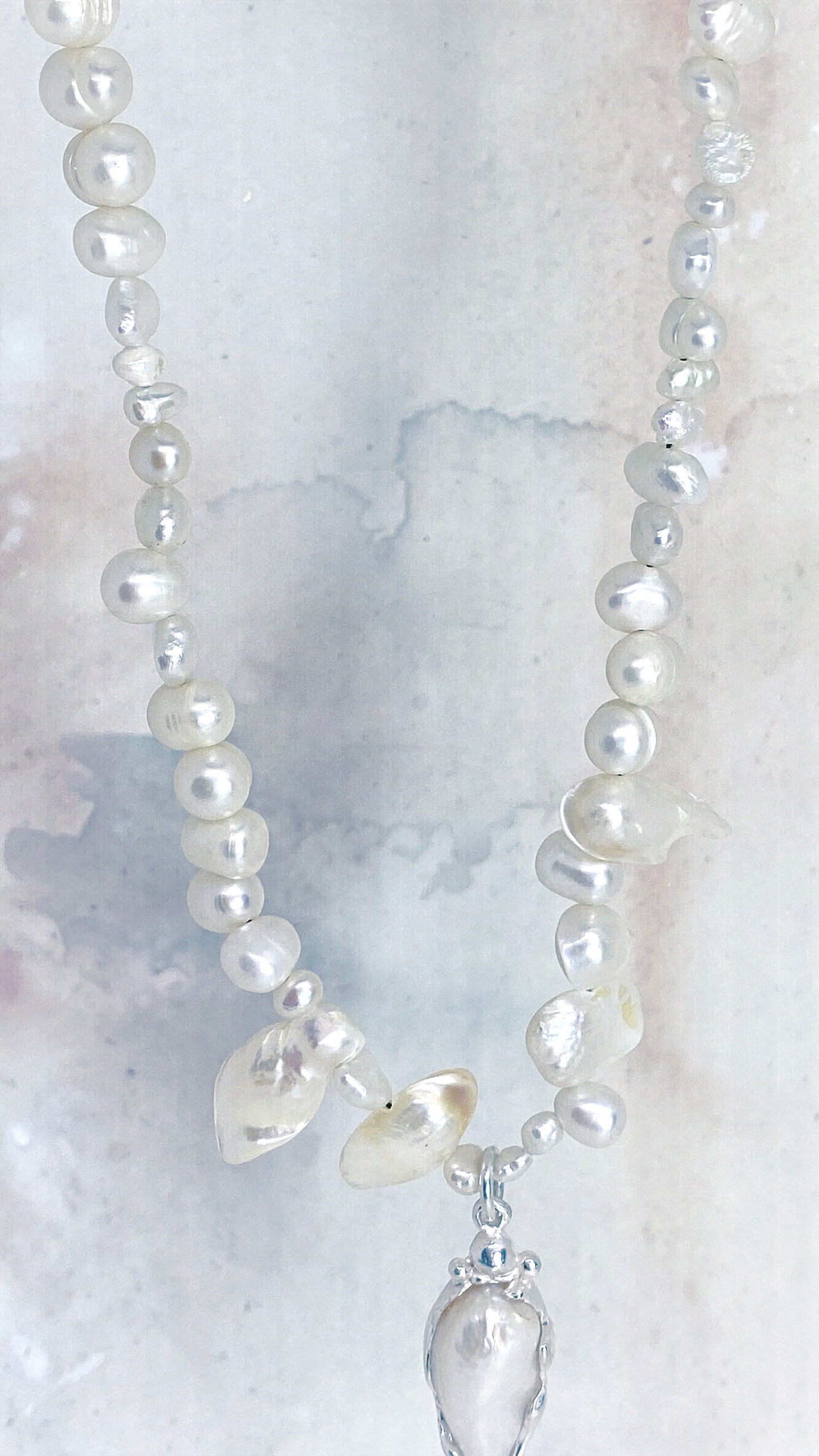 baroque blister teardrop pendant on flowing fresh water pearl strand