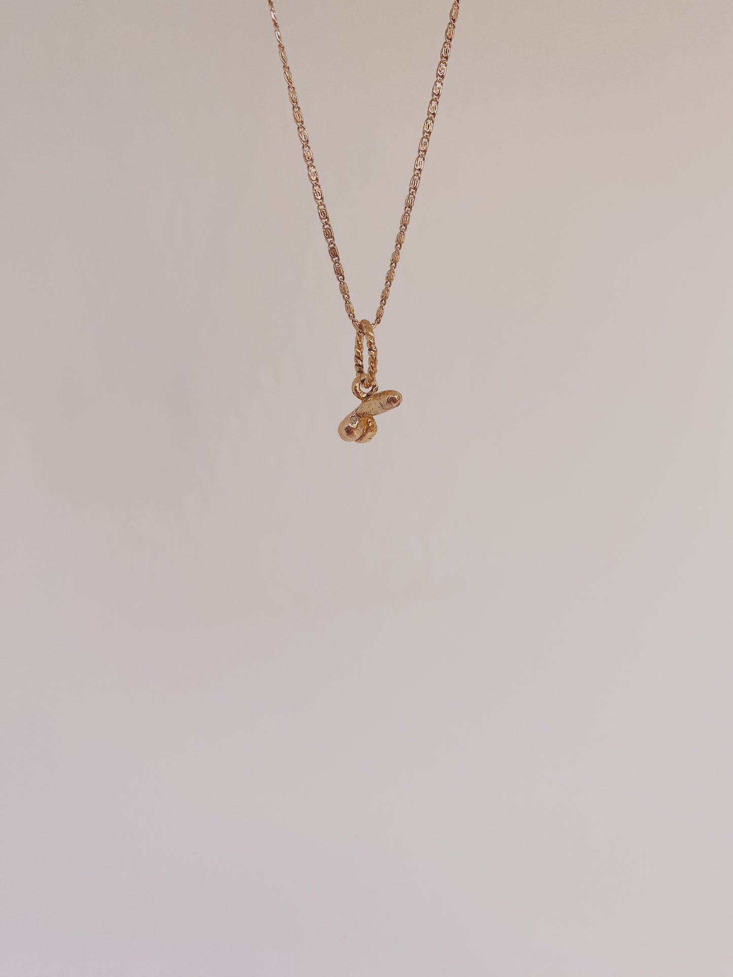 solid 14k gold mini d charm // 'minor rustic fertility god'
