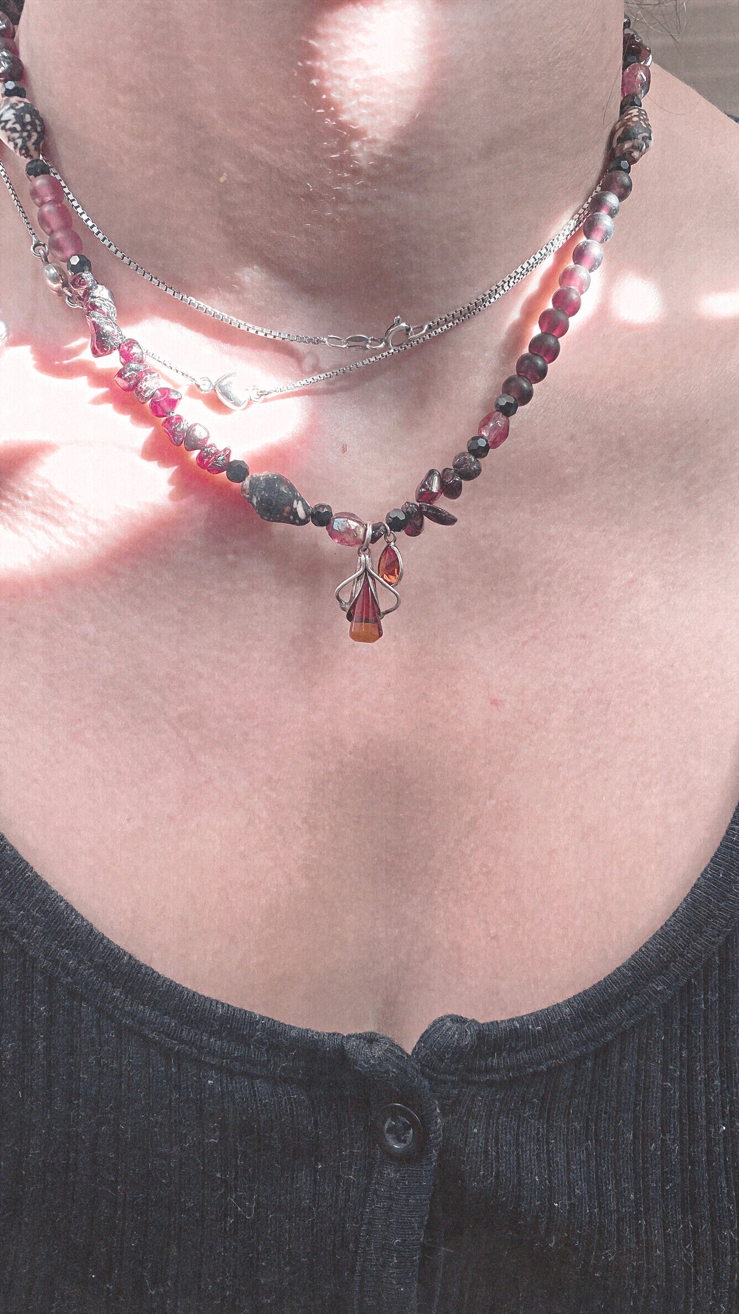 amber droplet and mini fire droplet on textured garnet, seashell, glass