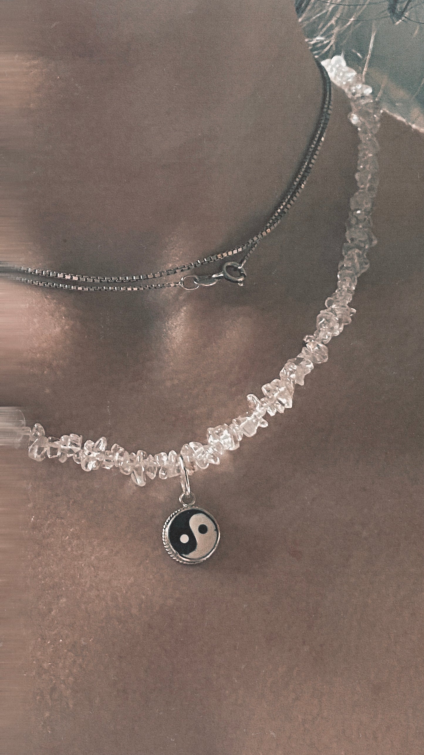vintage yin and yang silver pendant on radiant clear quartz
