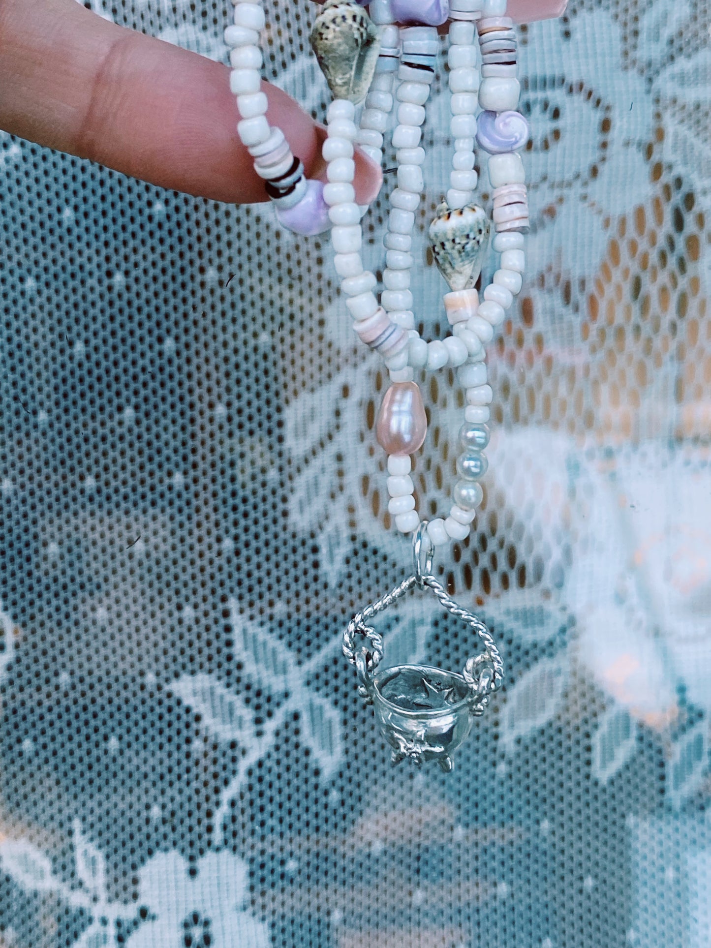 (reserved) shining sea // luminescent silver cauldron on beaded string