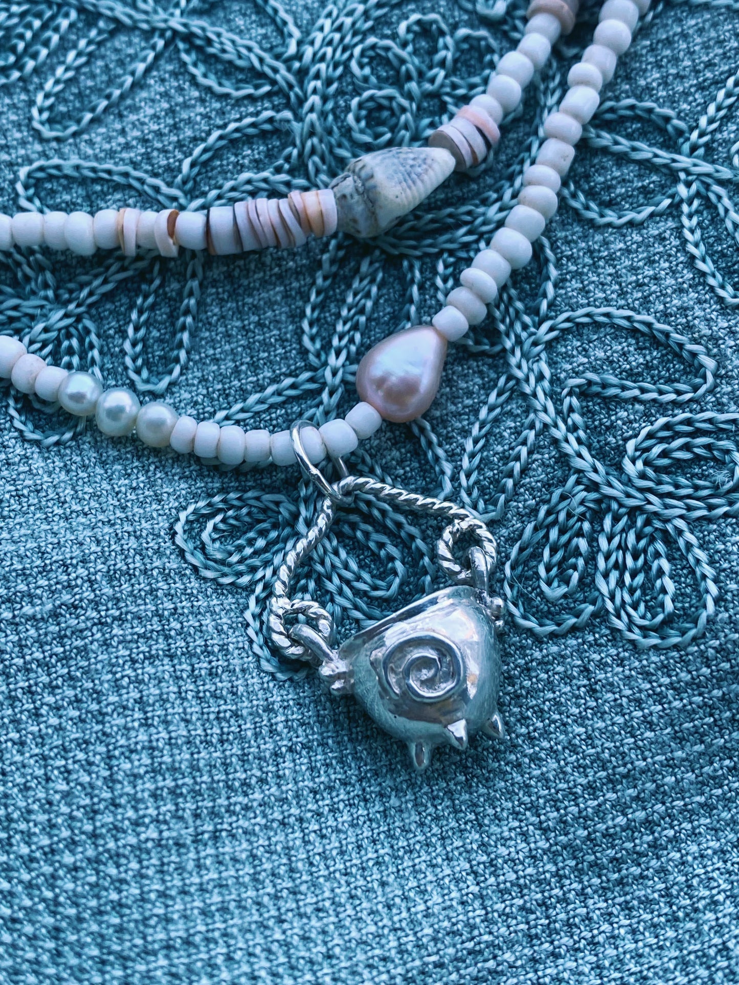 (reserved) shining sea // luminescent silver cauldron on beaded string