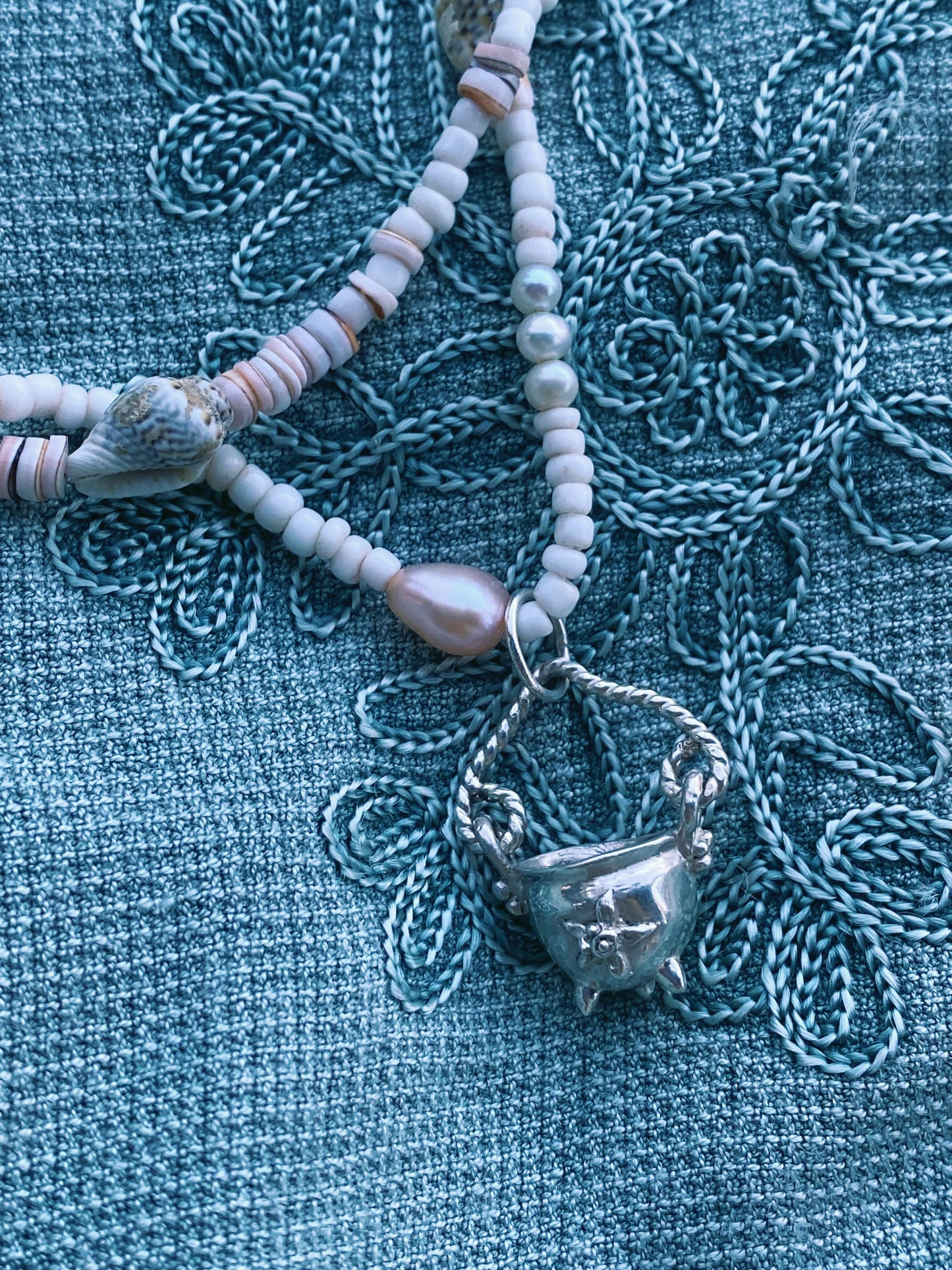 (reserved) shining sea // luminescent silver cauldron on beaded string