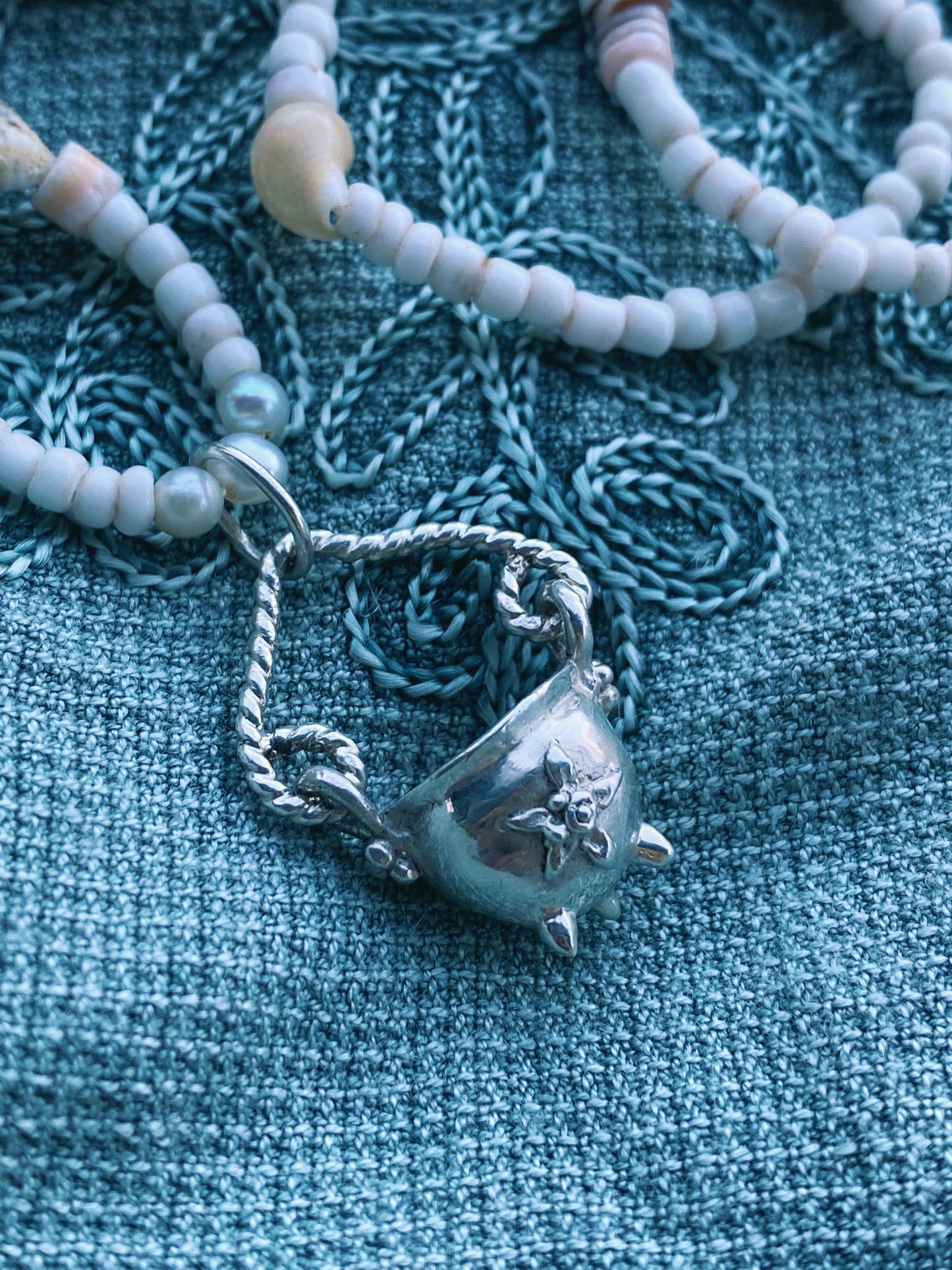 (reserved) shining sea // luminescent silver cauldron on beaded string