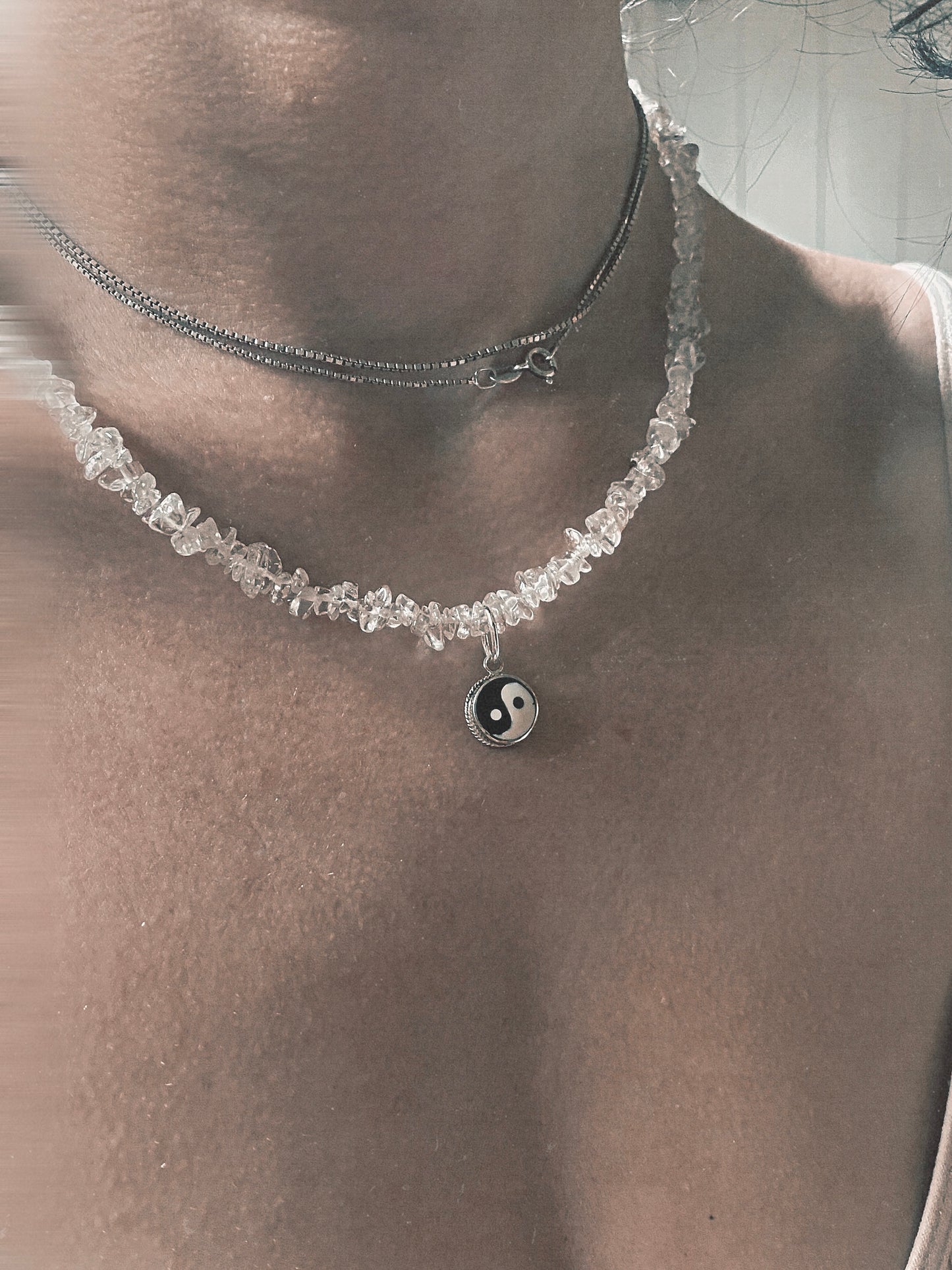 vintage yin and yang silver pendant on radiant clear quartz