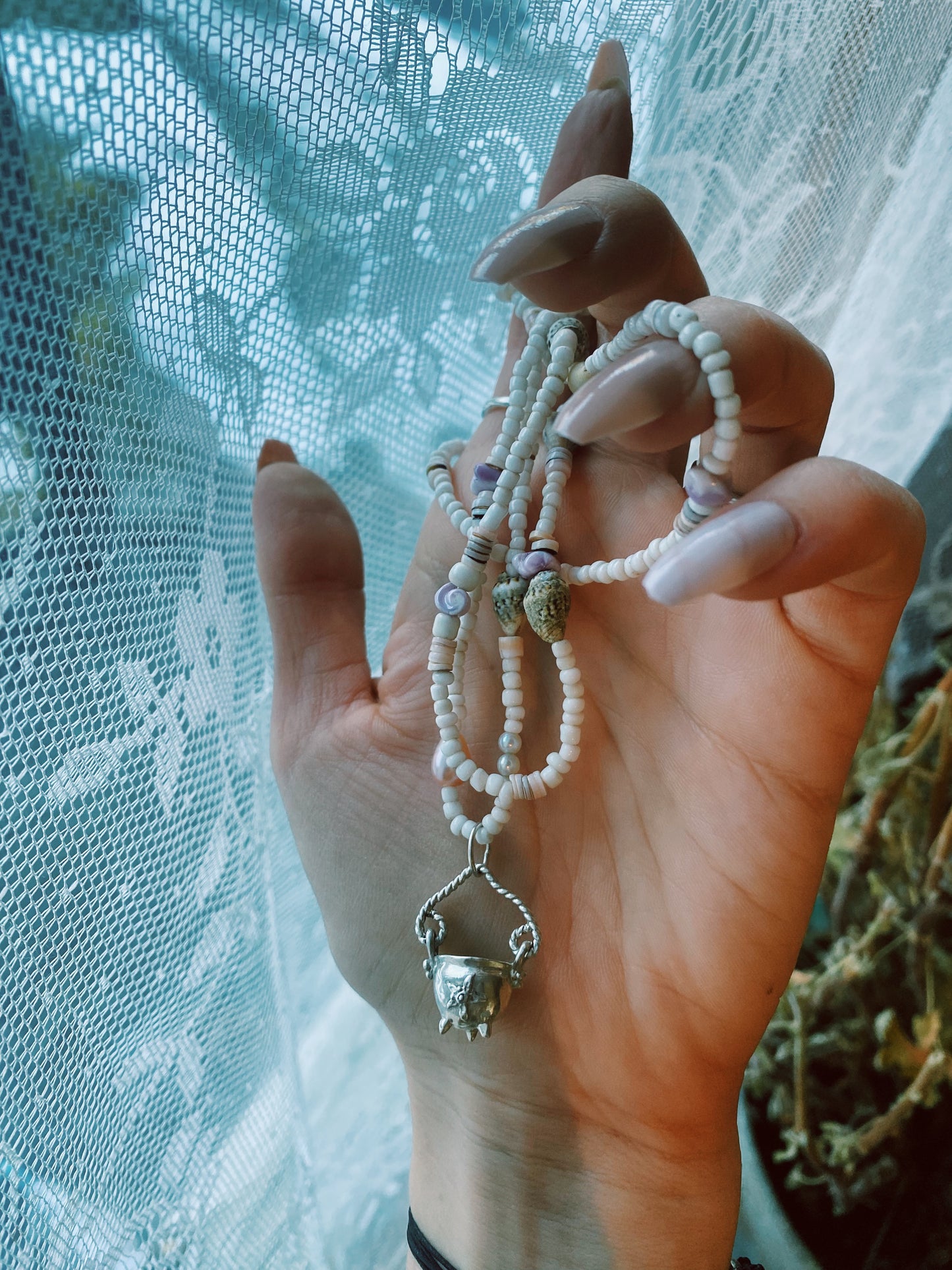 (reserved) shining sea // luminescent silver cauldron on beaded string