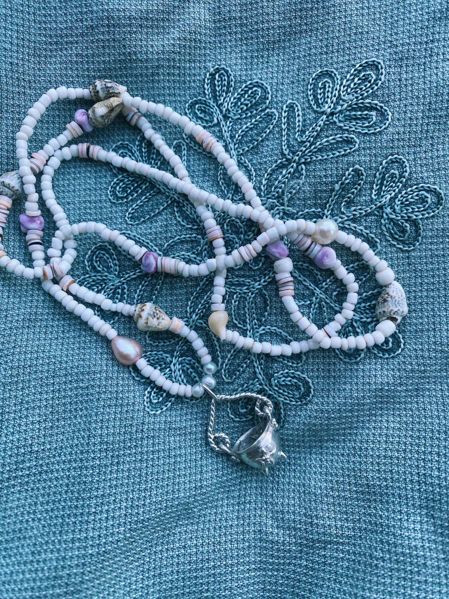 (reserved) shining sea // luminescent silver cauldron on beaded string