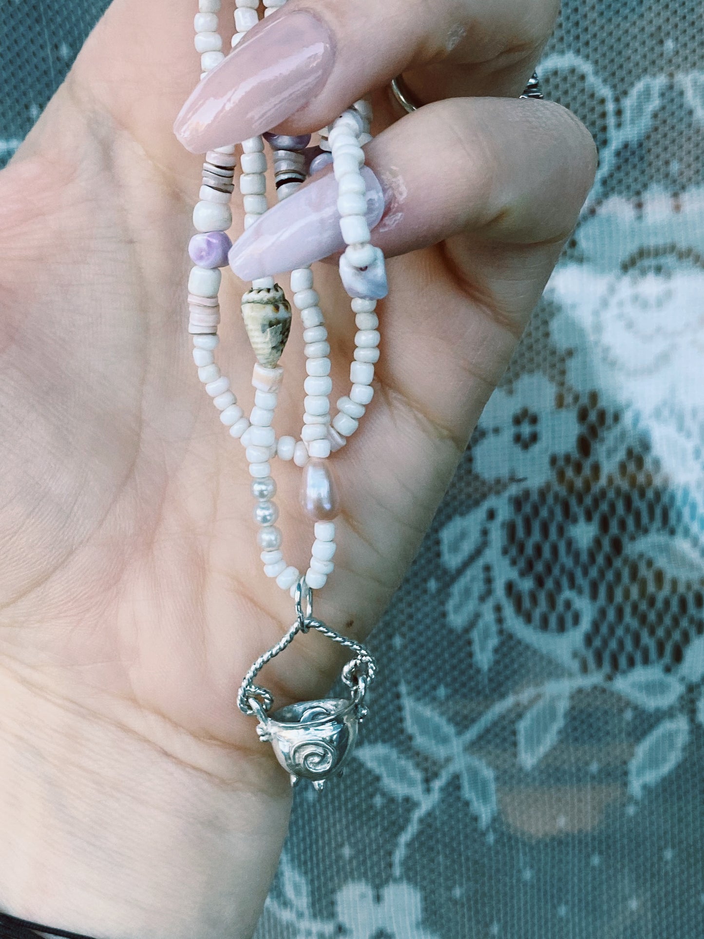 (reserved) shining sea // luminescent silver cauldron on beaded string