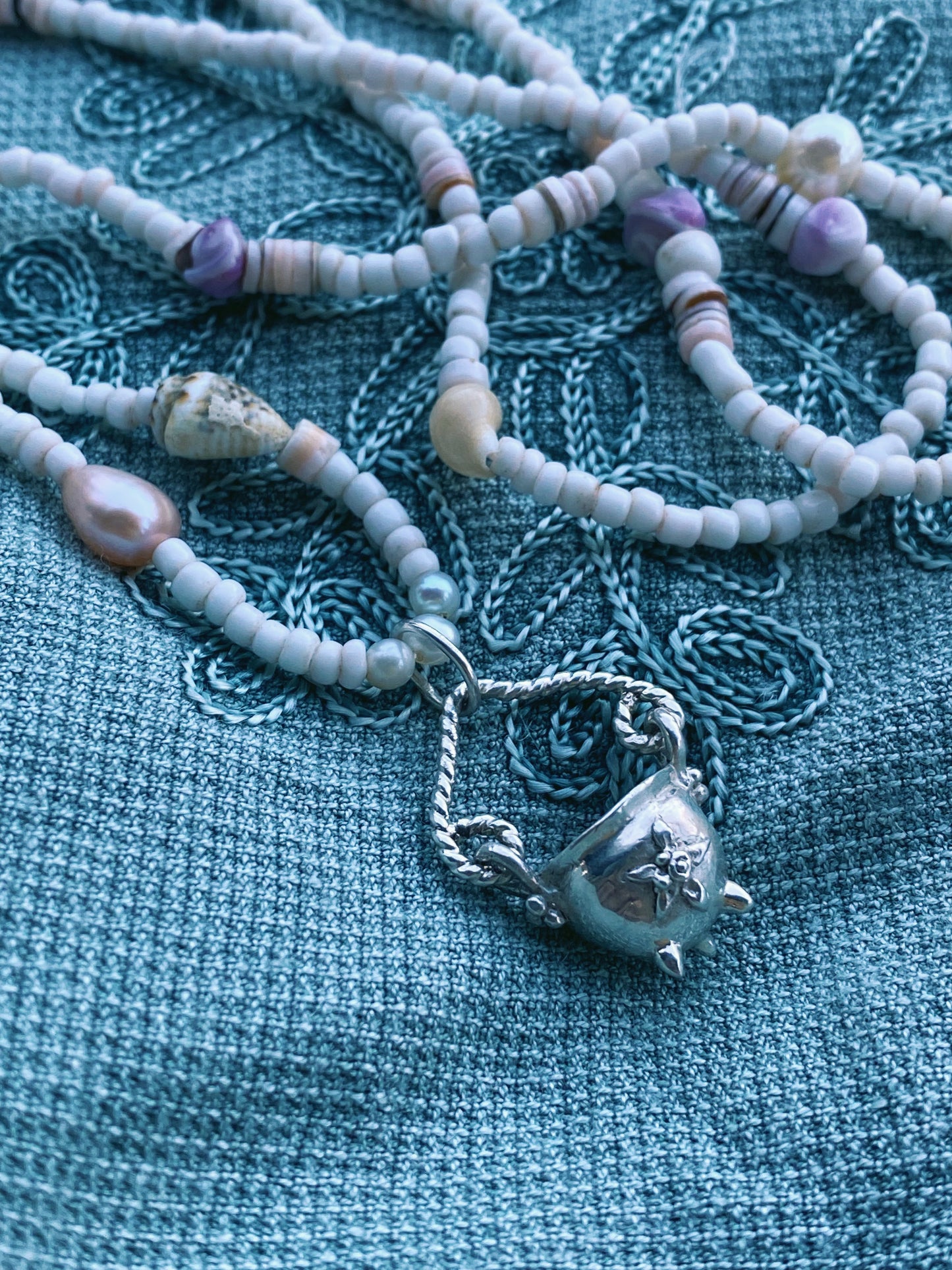 (reserved) shining sea // luminescent silver cauldron on beaded string