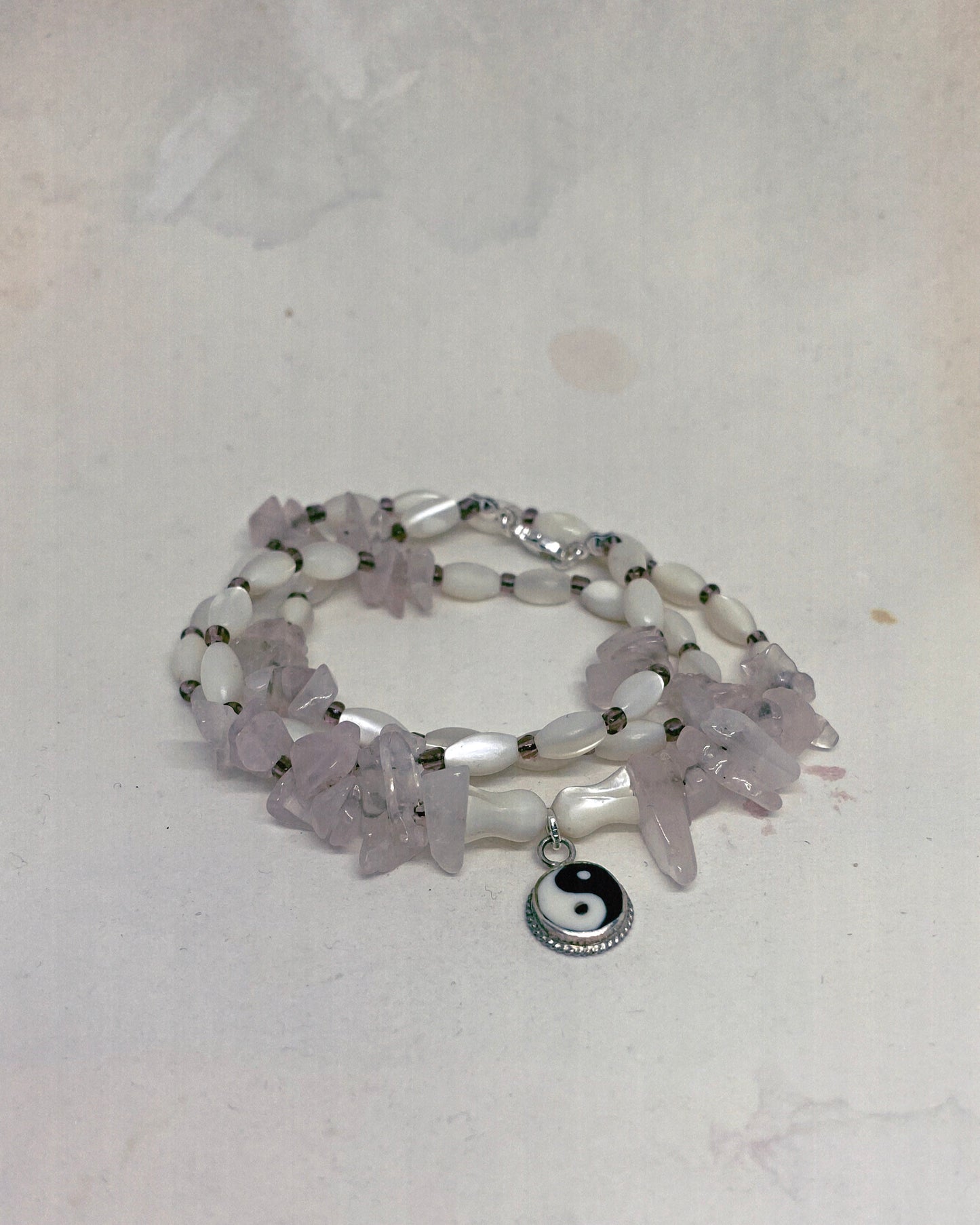vintage yin & yang with rose quartz and luminous seashell rice