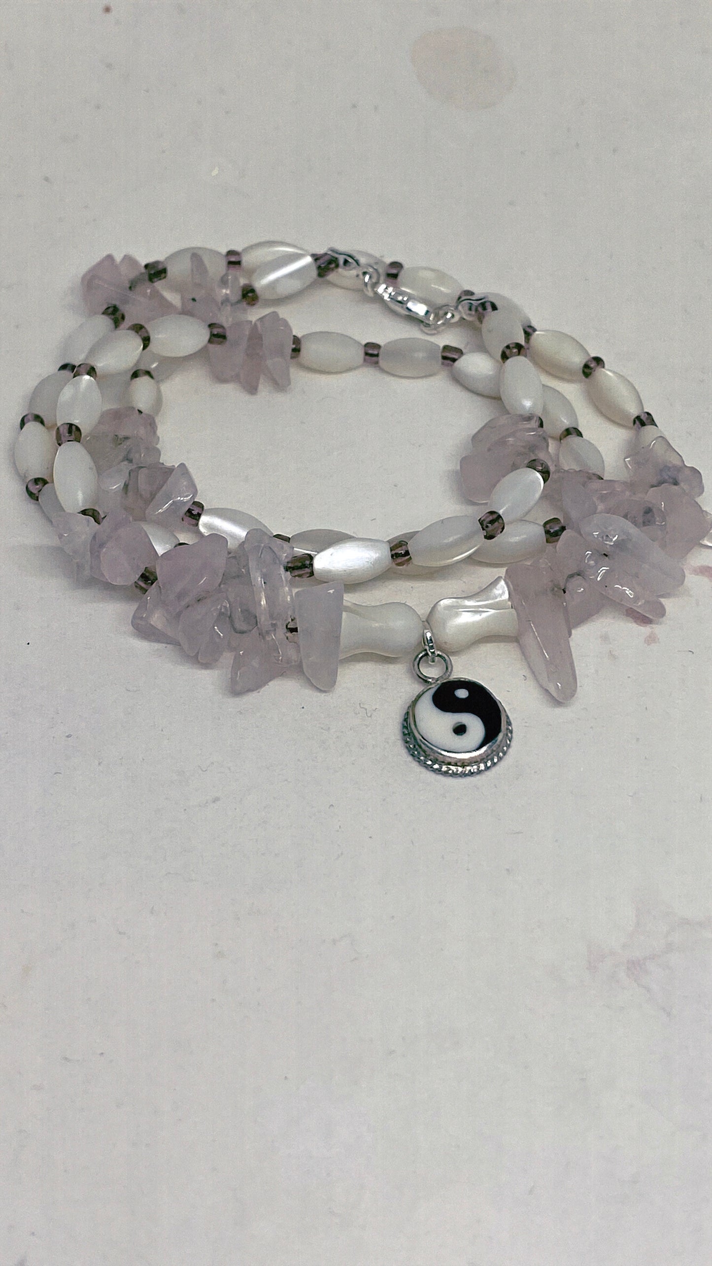 vintage yin & yang with rose quartz and luminous seashell rice