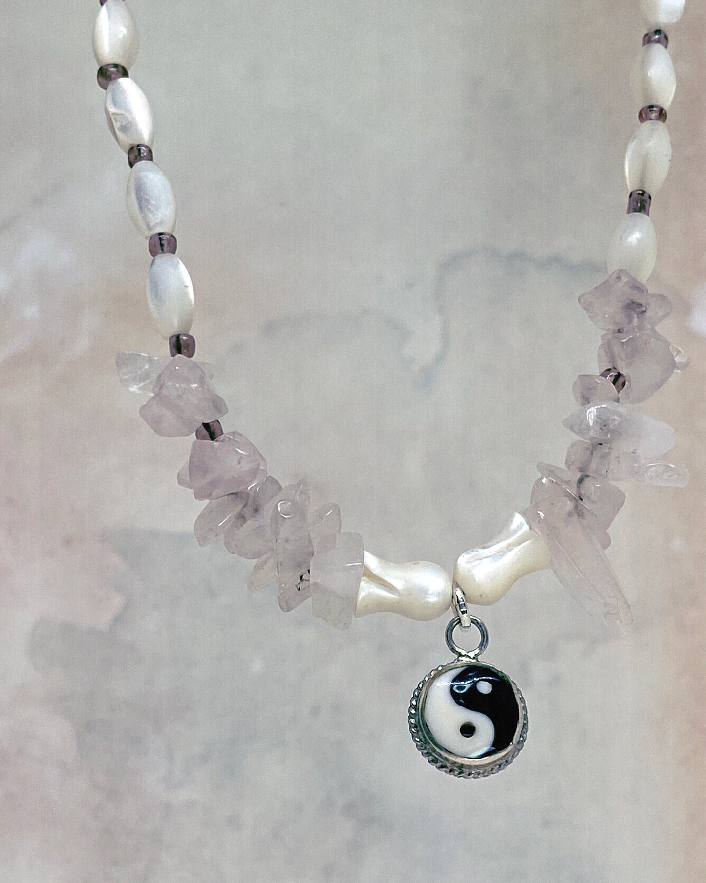 vintage yin & yang with rose quartz and luminous seashell rice