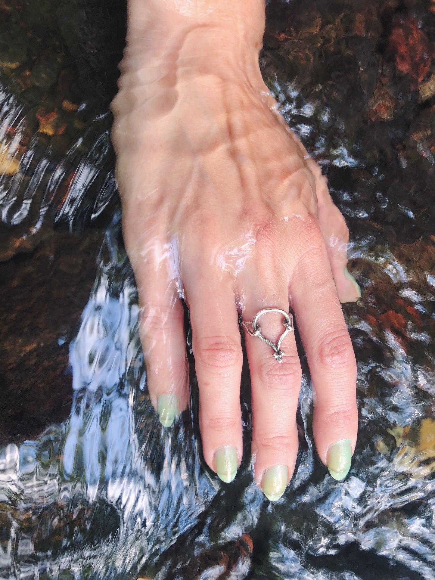 true coil // circle in circles ligature ring
