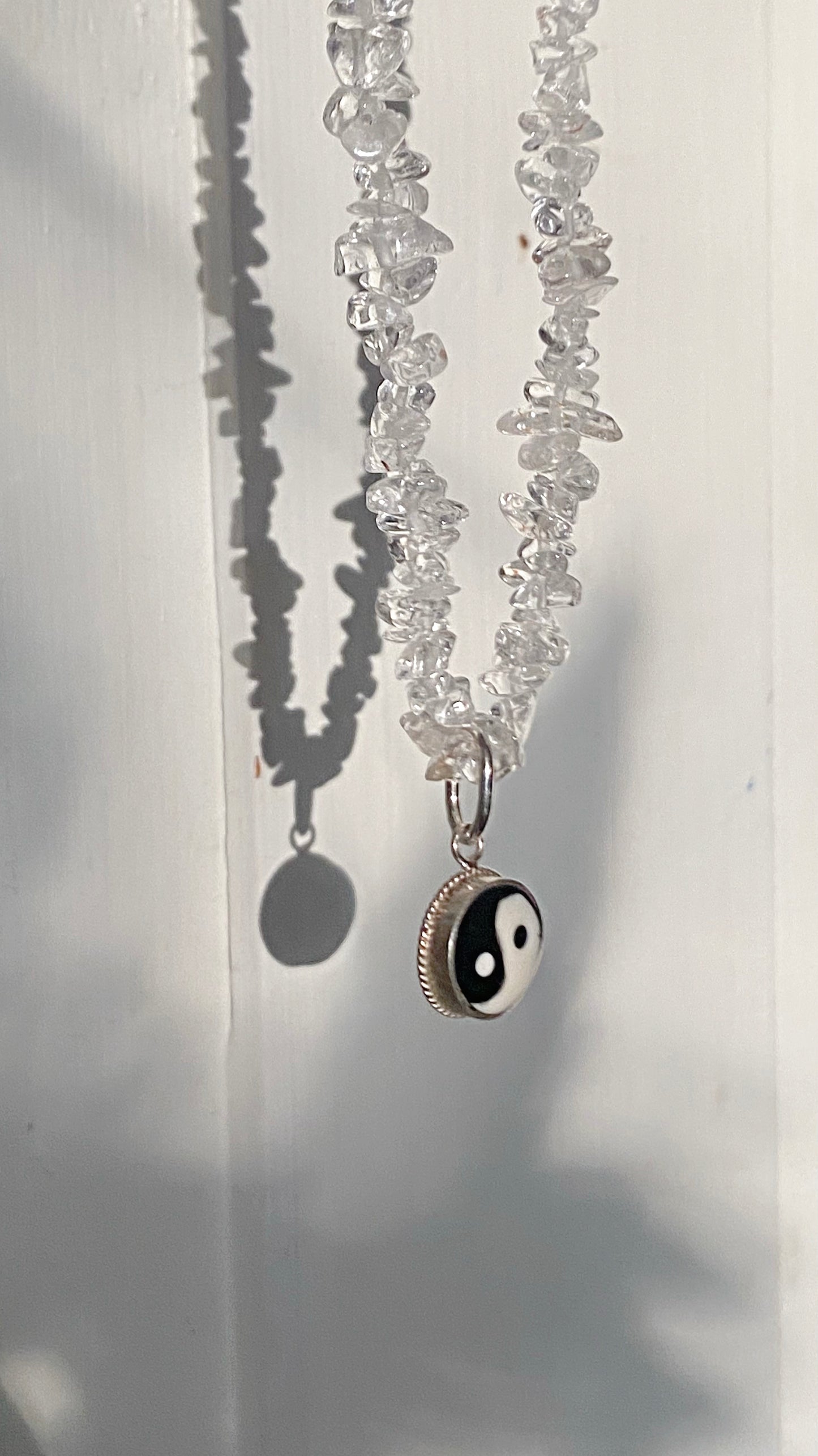 vintage yin and yang silver pendant on radiant clear quartz