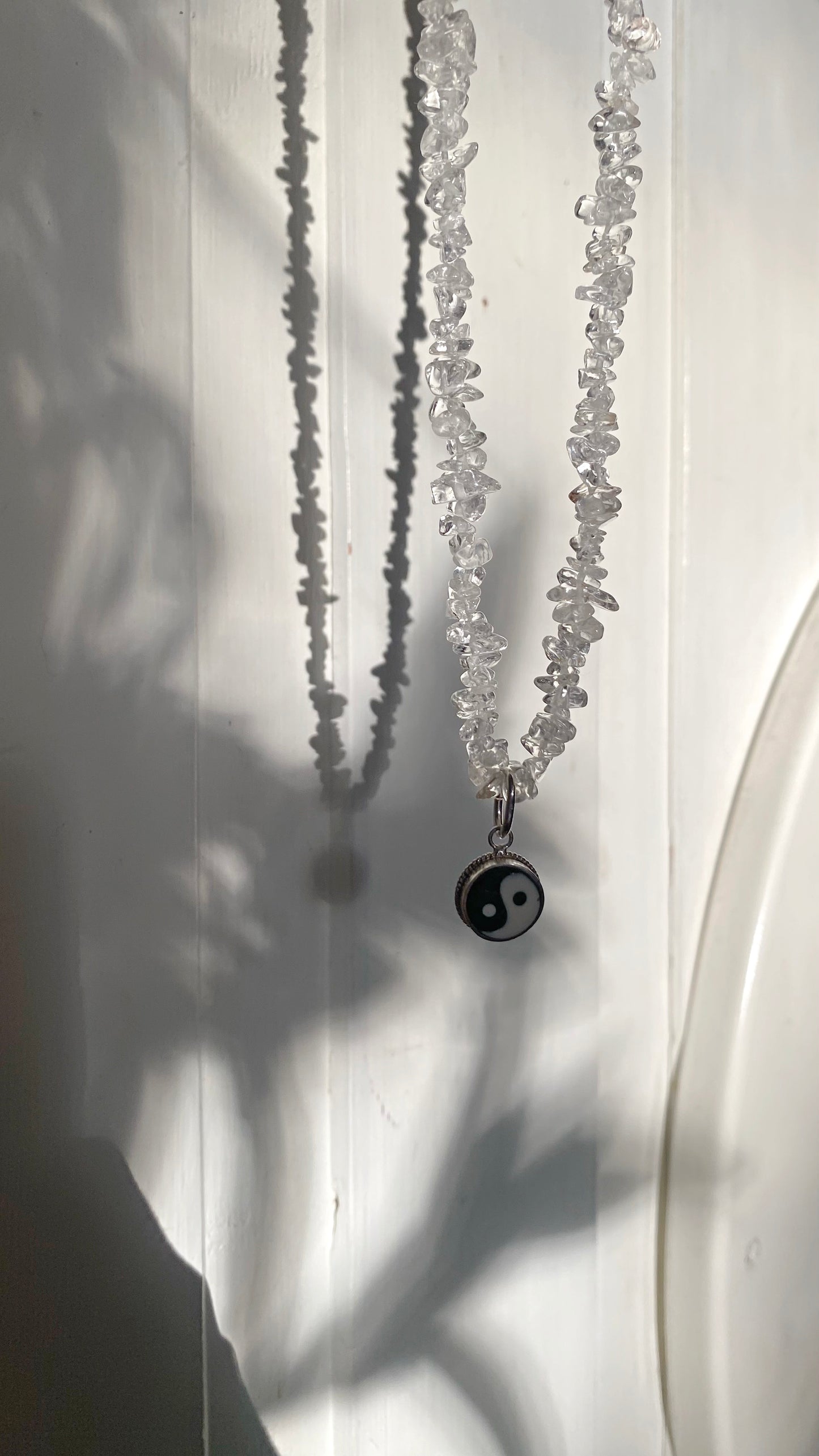 vintage yin and yang silver pendant on radiant clear quartz