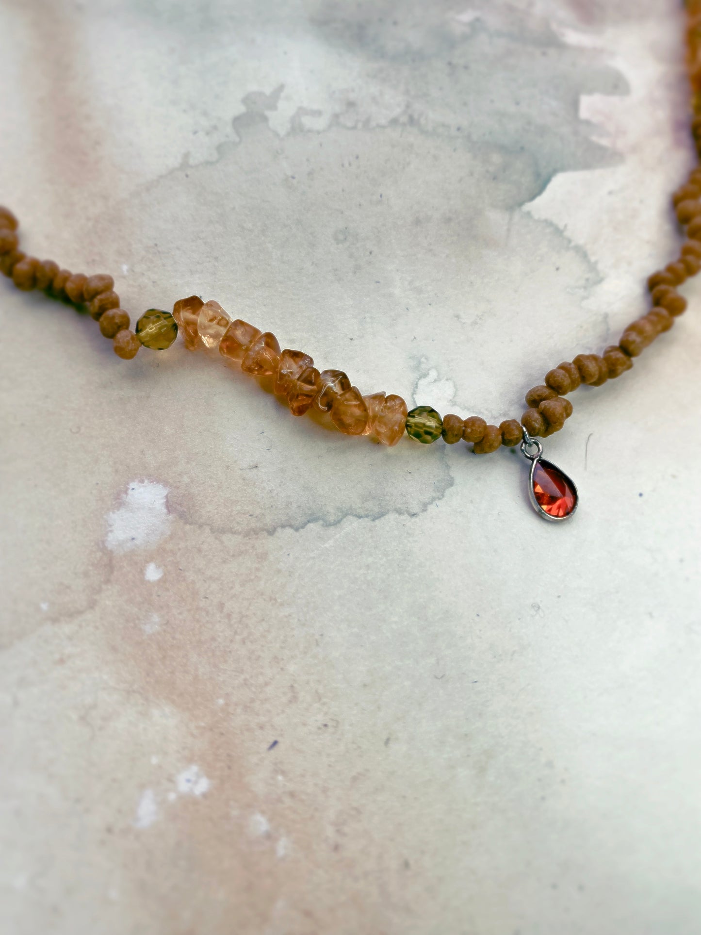 luminous fire droplet with structured citrine, green faceted glass and wood