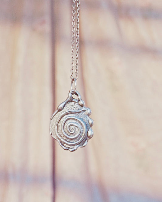 swirl // one of a kind silver coin spiral charm
