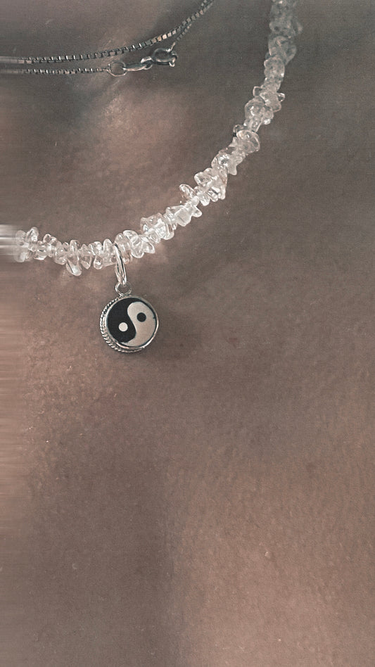 vintage yin and yang silver pendant on radiant clear quartz