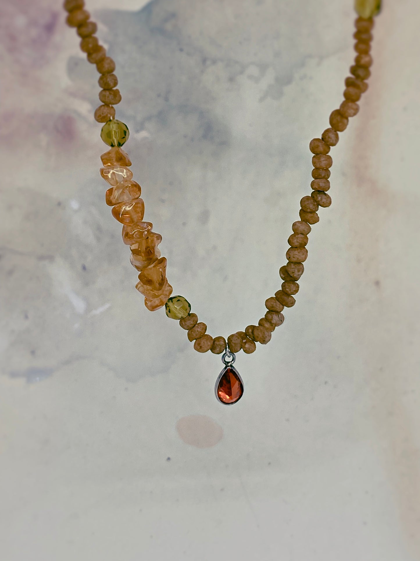 luminous fire droplet with structured citrine, green faceted glass and wood