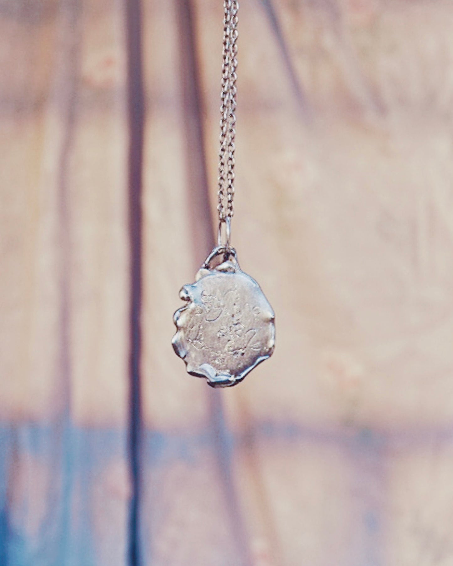 swirl // one of a kind silver coin spiral charm