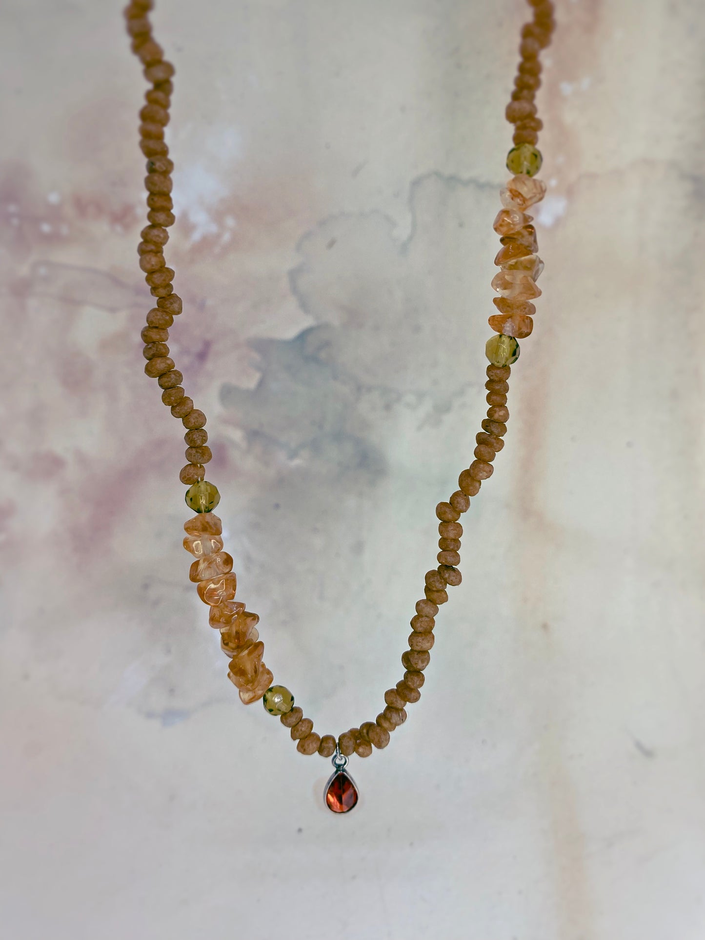 luminous fire droplet with structured citrine, green faceted glass and wood