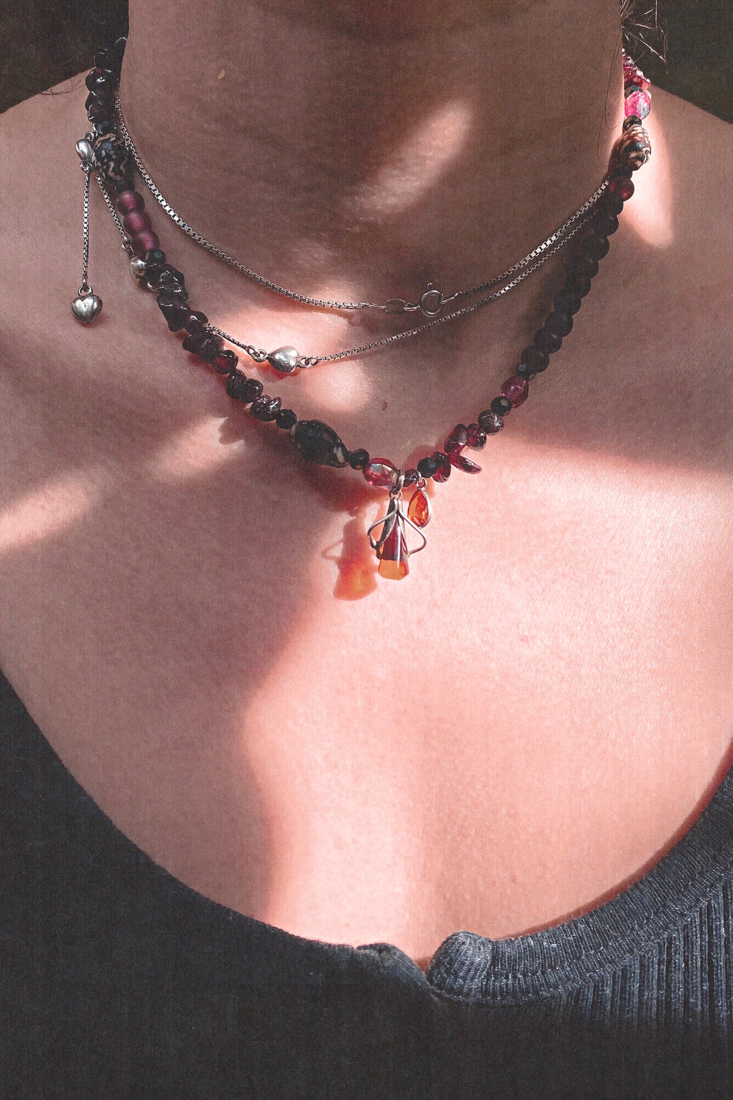 amber droplet and mini fire droplet on textured garnet, seashell, glass