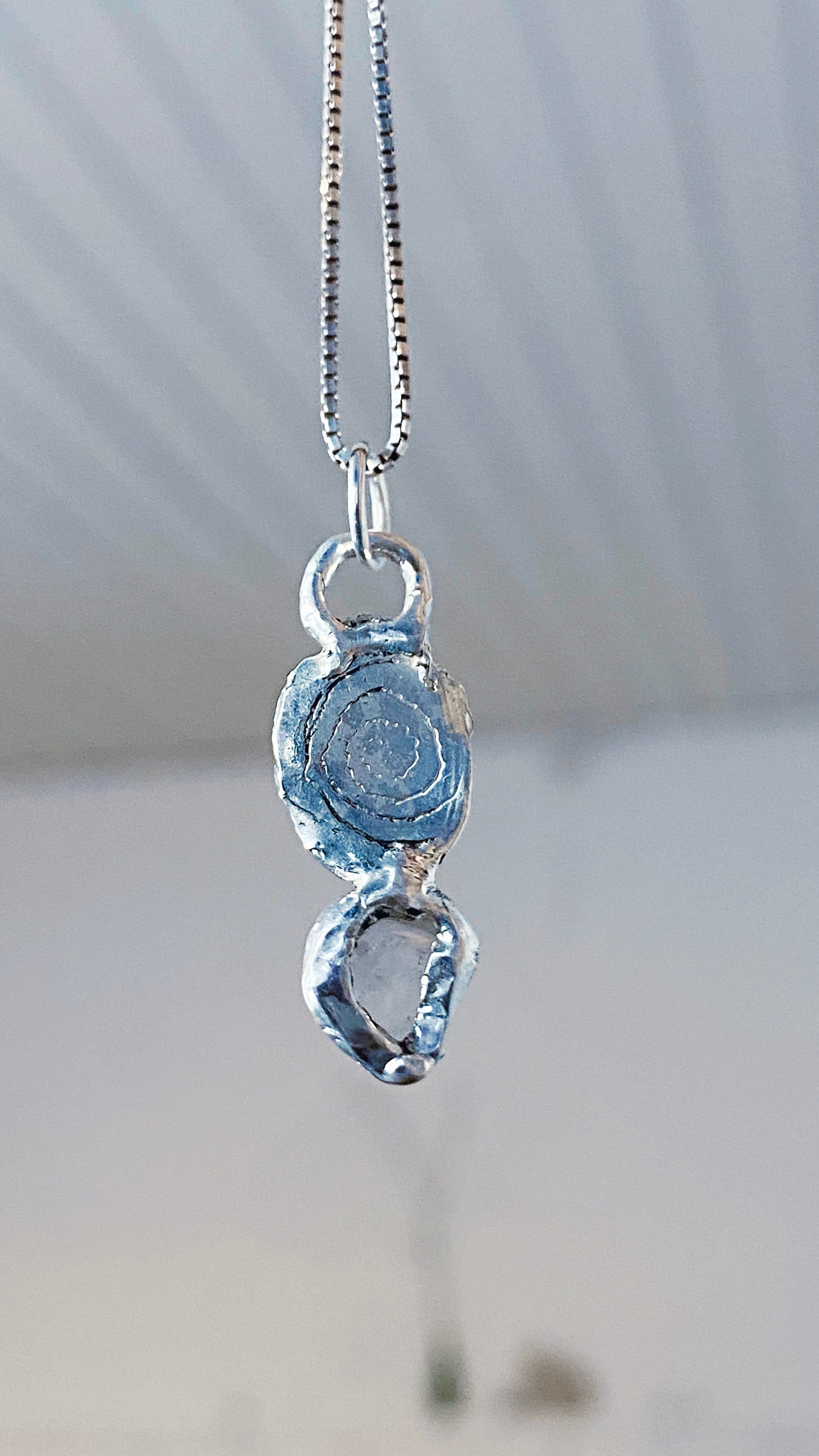 crystal gaze I // silver coin of a kind medallion