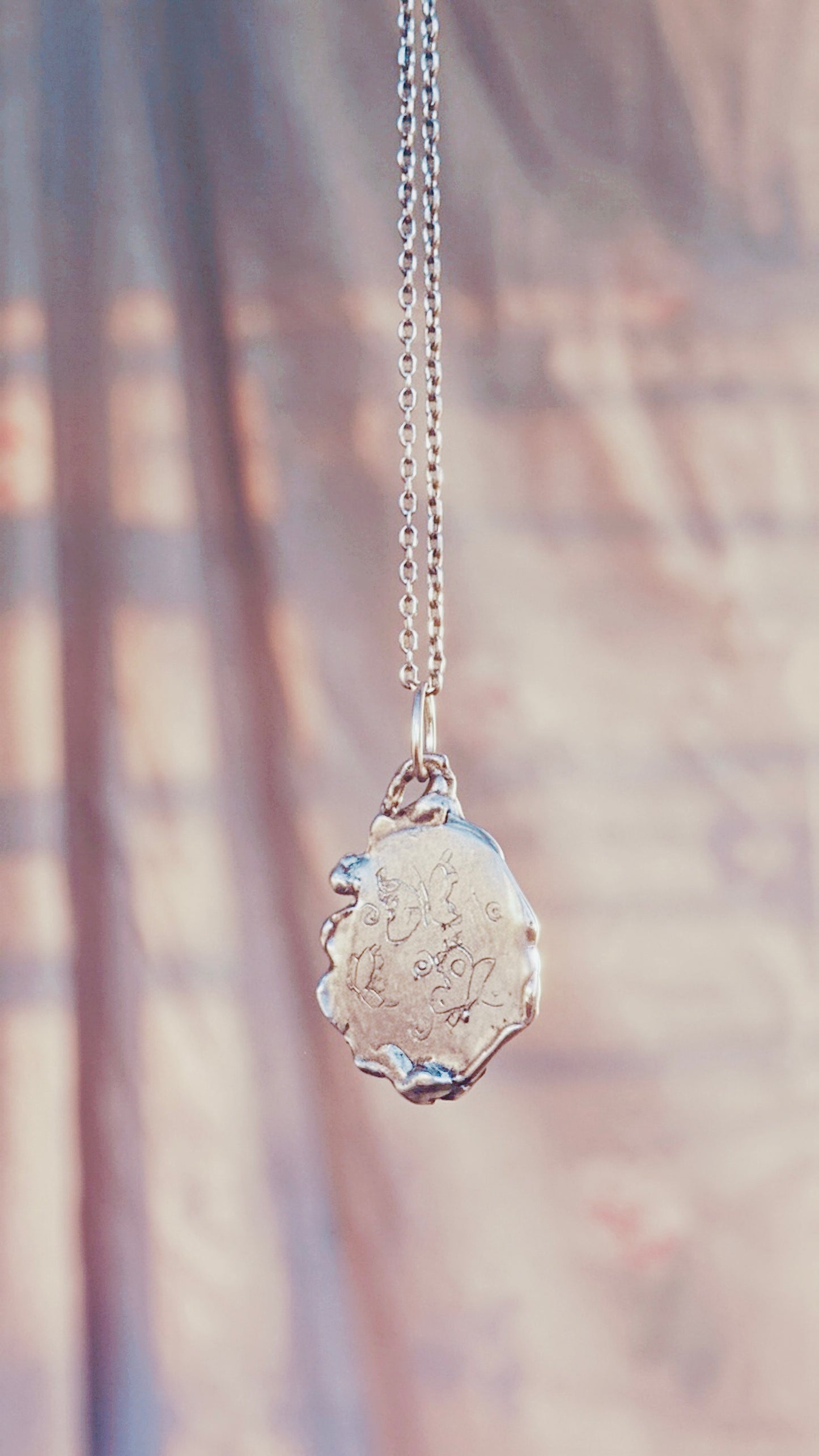 swirl // one of a kind silver coin spiral charm