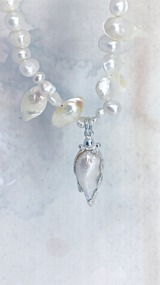 baroque blister teardrop pendant on flowing fresh water pearl strand