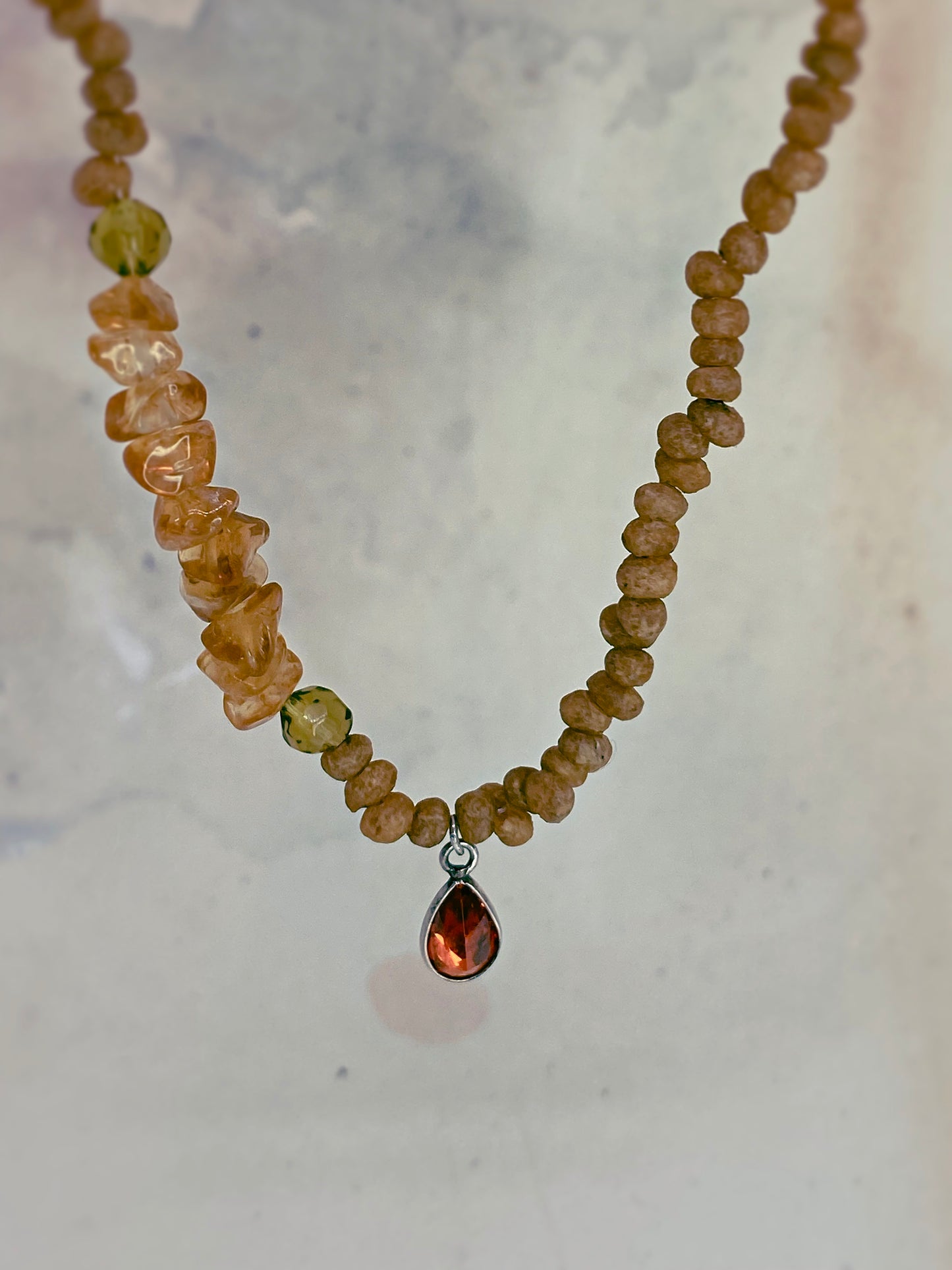 luminous fire droplet with structured citrine, green faceted glass and wood