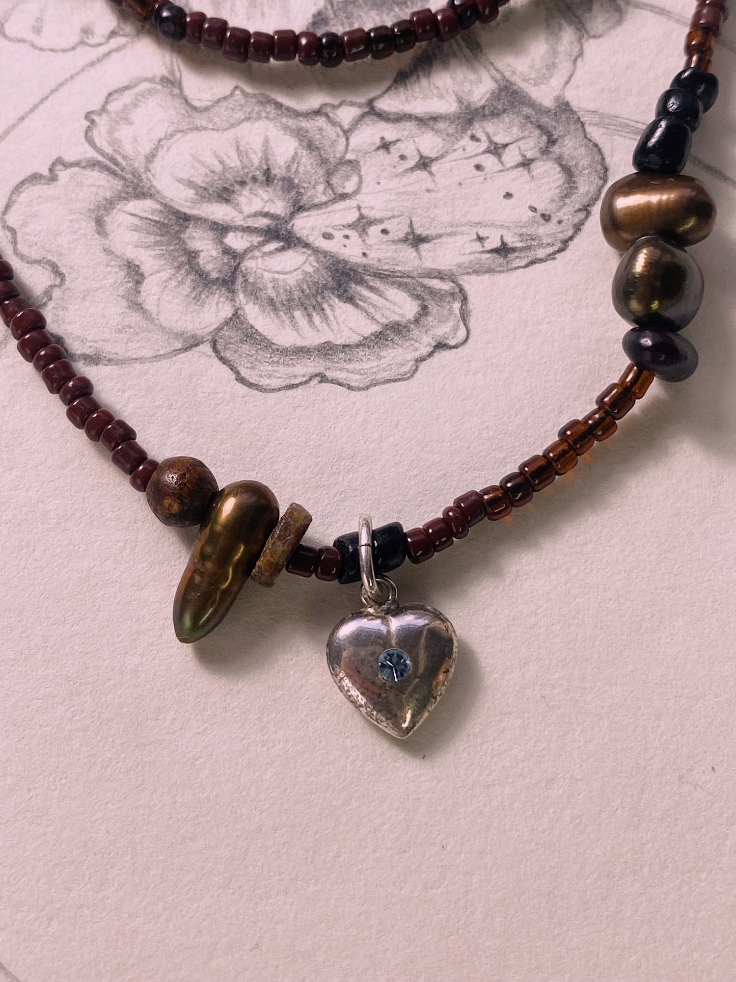 beaded vintage heart charm with blue stone