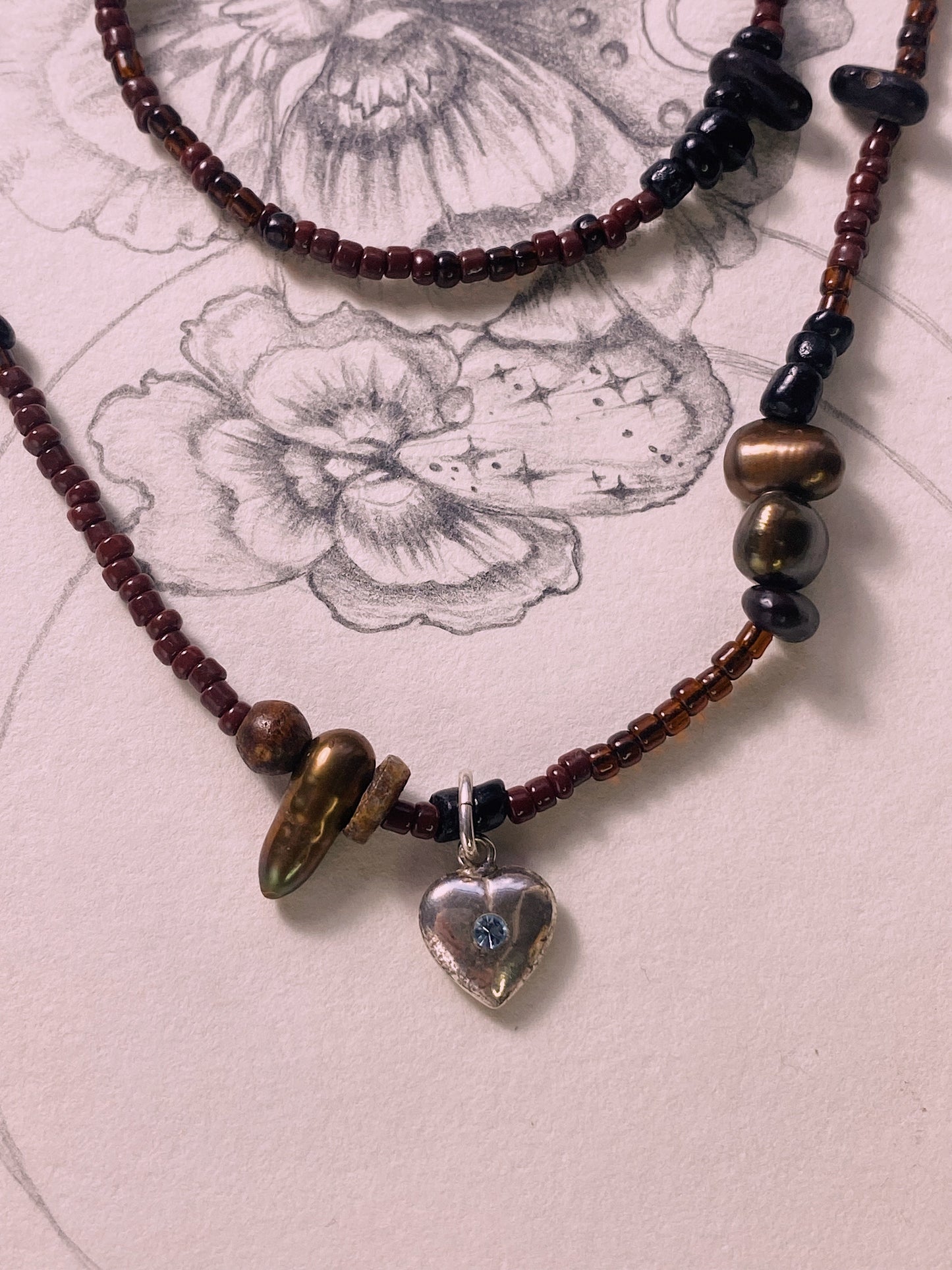 beaded vintage heart charm with blue stone